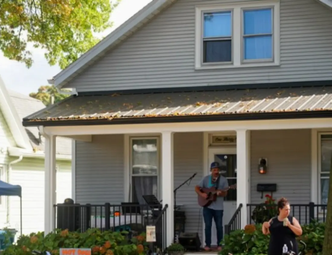 Rev. Haze performing from a neighborhood porch